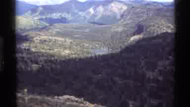 Holland Lake Montana USA (1972): Backpacking Man Watches View