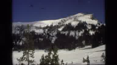 Idaho USA (1972): The Mountain Range Set Beneath The Picturesque Blue Sky Dotted