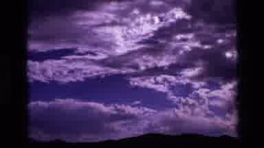 Idaho USA (1972): Vintage Shot Of Beautiful Sky In The Forest Over Mountains
