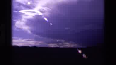 Idaho USA (1972): Sun Reflection With Clouds Thunderstorm Forming In Background