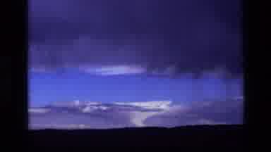 Idaho USA (1972): Hazy Bluish Blue Clouds With Strong Winds In High Sky Being