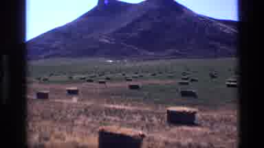 Idaho USA (1972): Field Of Hay Squares For Many Acres With Hill In Background