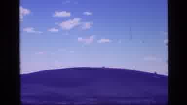 Idaho USA (1972): Lone Hill In The Distance With A Beautiful Clear Sky In The