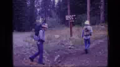 SCAPEGOAT WILDERNESS MONTANA USA .MP-1973: A Group Of Hikers Hiking Down A Trail