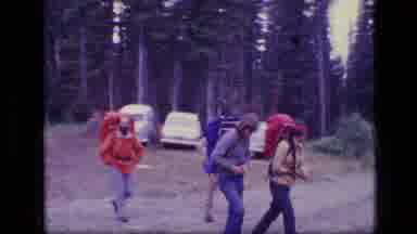 SCAPEGOAT WILDERNESS MONTANA USA .MP-1973: Hikers Carrying Heavy Backpacks Roam