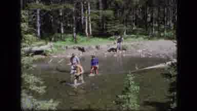 SCAPEGOAT WILDERNESS MONTANA USA .MP-1973: Four People Walking Across A Small