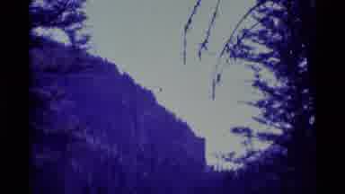 Agate Springs Montana USA (1975): High Cliff In Forest And Rushing Water Over