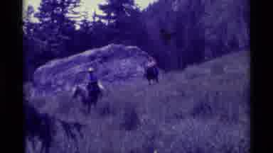 Agate Springs Montana USA-1975: Three Men Riding Horses Down A Hillside
