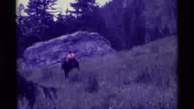 Agate Springs Montana USA (1975): Horseback Rider Trotting Across Mountainous
