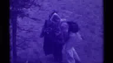 Agate Springs Montana USA (1975): Group Of People Hiking Through Forest With A