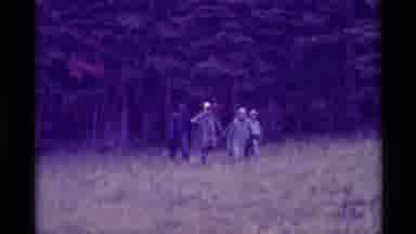 Agate Springs Montana USA (1975): People Walking In A Field While It Was Raining