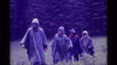 Agate Springs Montana USA (1975): Five People Walking From A Meadow Into A Forest