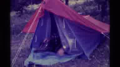 Agate Springs Montana USA (1975): A Man Getting Out Of A Purple Tent With A Red
