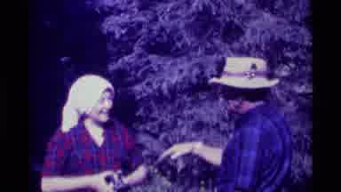 Agate Springs Montana USA (1975): Mother Hanging Wet Clothes On A Line While