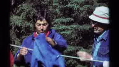 Agate Springs Montana USA (1975): A Group Of People Camp In The Woods And Set Fire
