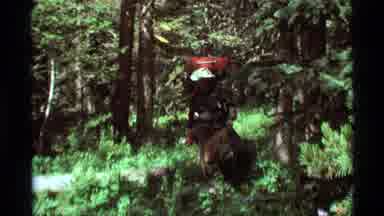 Agate Springs Montana USA (1975): Two Men Hiking In A Green Forest Wearing Hats
