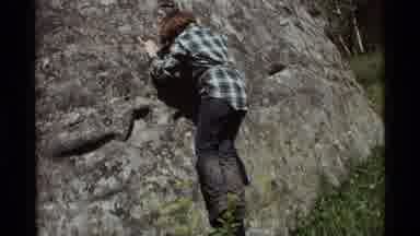 Agate Springs Montana USA (1975): A Young Boy With Brown Hair Climbing A Giant