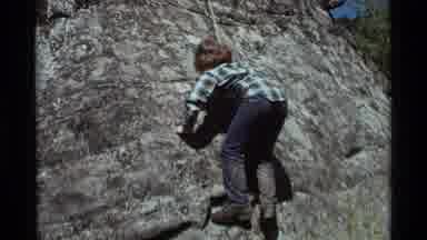 Agate Springs Montana USA (1975): Person Attempting To Climb A Rock Face With Only