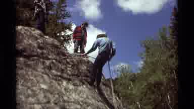 Agate Springs Montana USA (1975): Man In Cowboy Hat Repels Down The Side Of A