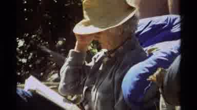 Agate Springs Montana USA (1975): Person Wearing A Hat Reading Outside In The