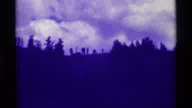 Agate Springs Montana USA (1975): Dark Purple Hills With Tall Trees In Front Of