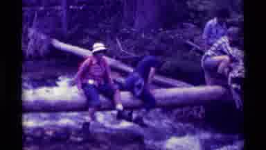 Agate Springs Montana USA-1975: Hikers Crossing Log And Climbing Mountain