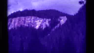 Agate Springs Montana USA (1975): Tall Snowy Mountains With Trees Sniff The