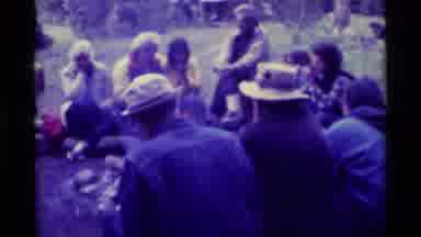 Agate Springs Montana USA (1975): A Group Of People Sitting On Logs Around A