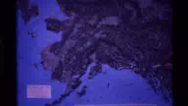 Alaska USA (1977): Pointing To A Map Of Europe On A Large Screen