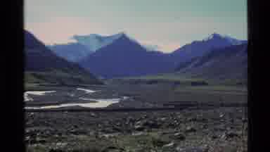 Alaska USA (1977): A Hand Pointing To A Location On A Globe And Then An Area