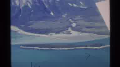 Alaska USA (1977): A View Of Mountain Peaks Surrounded By Water And Dry Land
