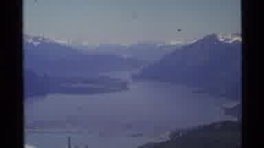 Alaska USA (1977): Aerial Footage Of Mountains And Lake With Glacier Runoff