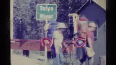 Alaska USA (1977): A Group Of Men And Women Backpackers Walking Across Talya River