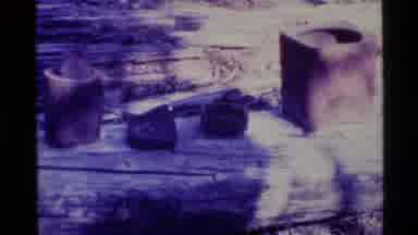 Alaska USA (1977): Old Pottery And Two People Using A Railing To Climb A Trail