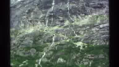 Alaska USA (1977): Aerial View Of A Terrain Consisting Of Rocks Plants And Trees