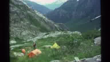 Alaska USA (1977): Campers In Tents Enjoy View From Grassy Valley Of Snow Capped