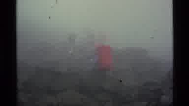 Alaska USA (1977): People Wearing Red Backpacks Hiking On A Cloudy Winter Day