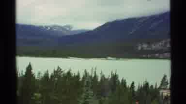 Alaska USA (1977): Moving Panorama Shot Of Mountainside Including Trees A River