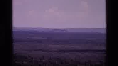 Idaho USA (1972): Overview Of A Mountainous Region With A Shot Of A Large Plain As