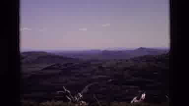 Idaho USA (1972): Zooming Into A Scenic View Of Large Grass Covered Rolling Hills