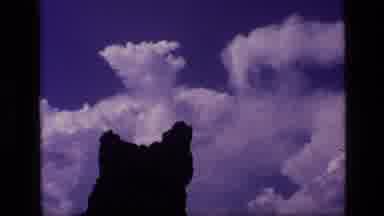 Idaho USA (1972): White Flowers On Small Bush In Rocky Field Puffy White Clouds
