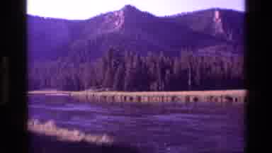 Idaho USA (1972): A Pretty Colorful View Of The Mountain Peaks Surrounded By Water