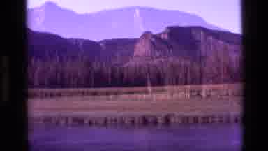 Idaho USA (1972): Calm River At The Base Of Pretty Rocky Mountains During The