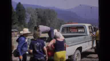 SCAPEGOAT WILDERNESS MONTANA USA .MP-1973: People Unloading Camping Gear From A