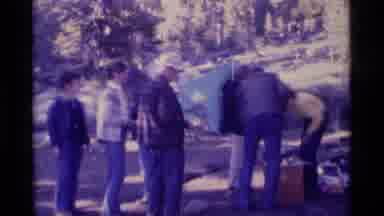 MINARET WILDERNESS CALIFORNIA USA .M-1975: Woman Serving Food To A Group Of