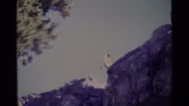 MINARET WILDERNESS CALIFORNIA USA .M-1975: A Man Rappels Down A Cliff While