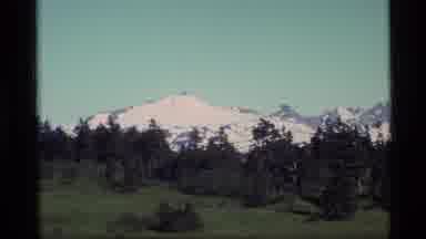 ALASKA USA-1977: Snow-Capped Mountains and Green Wilderness in Vintage 8mm Film