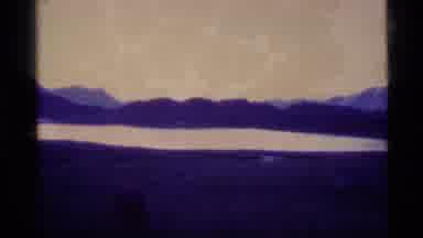 Alaska USA (1977): A View Of Dark High Mountain Peaks With Purple Dark Gloomy