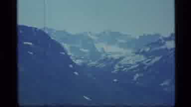 Alaska USA (1977): A View Of The Mountain Peaks Surrounded By Snow