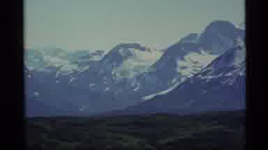 Alaska USA (1977): A View Of Mountain Peaks Covered With Snow